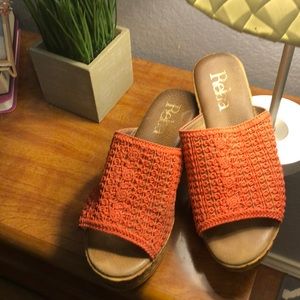 Orange platform shoes with orange crochet pattern